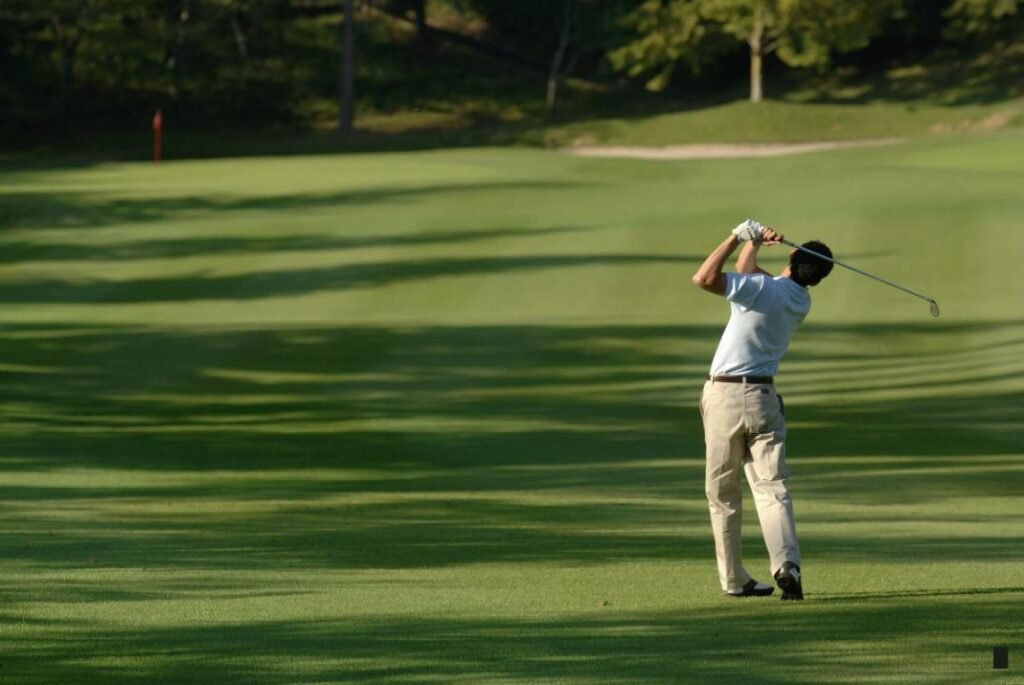 Golfer practicing the 90% swing rule on the course
