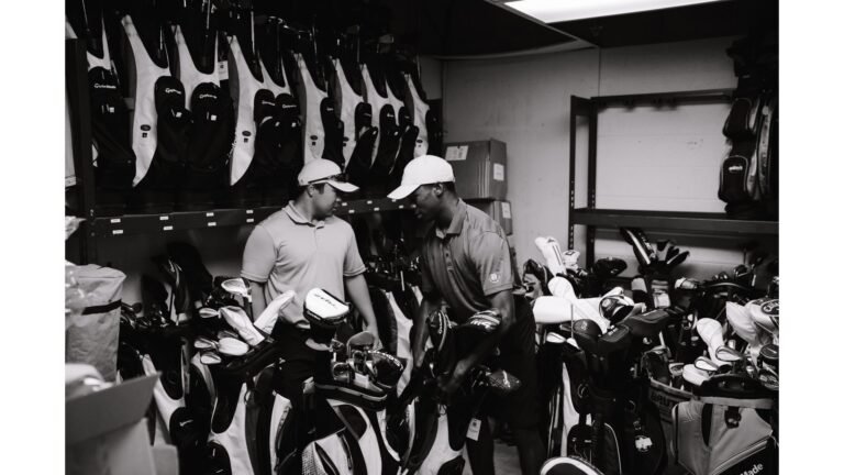 Golfer being professionally fitted for new golf clubs at a fitting studio